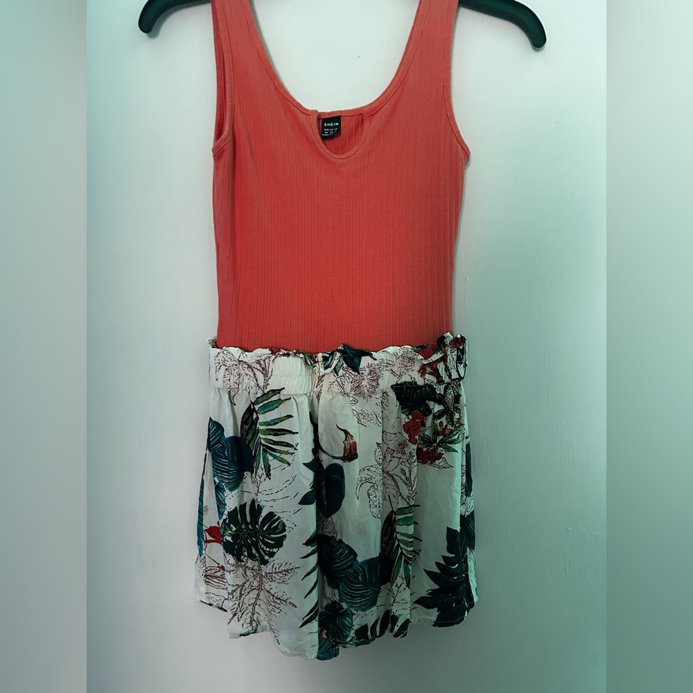 This is an orange and floral print romper from SHEIN that is a size extra small.
